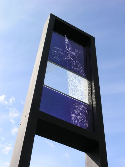 Sky Banner. 'Reaching the Sky'. Fused and clear textured glass. Sandblast carved. Height 1.8 meters. Karen Liversedge